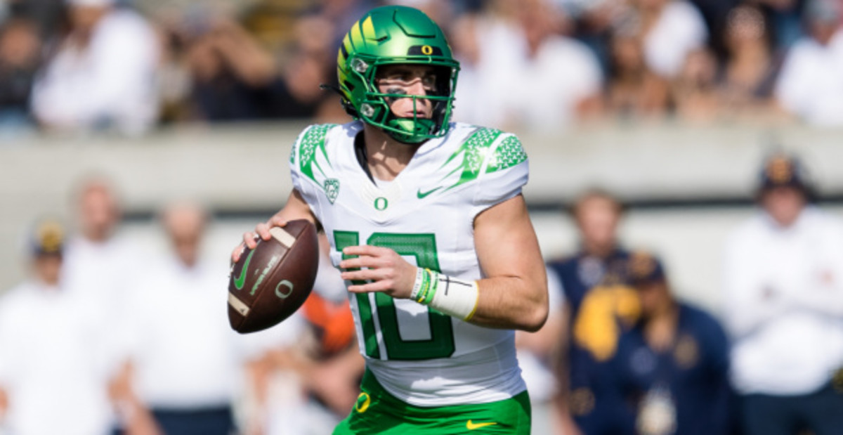 Oregon Ducks quarterback Bo Nix attempts a pass during a college football game.